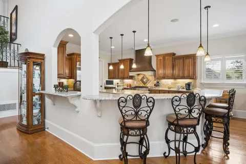 a white bath tub sitting in a bathroom next to a window