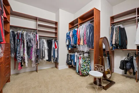 a view of a livingroom with furniture and a flat screen tv
