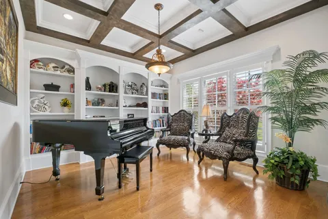 a kitchen with stainless steel appliances kitchen island granite countertop a refrigerator and a sink