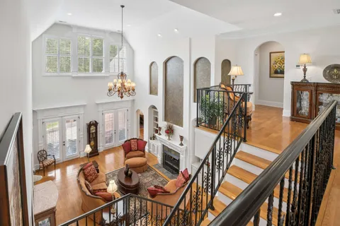 a living room with furniture and a lamp