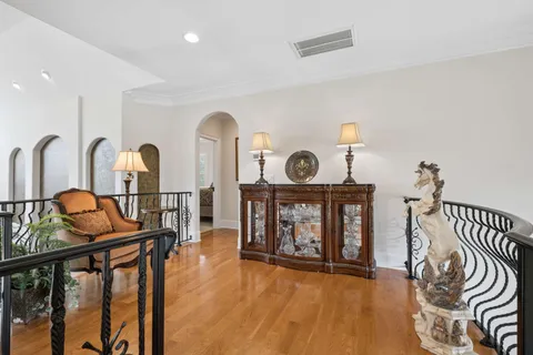 a bedroom with a large bed and a flat screen tv