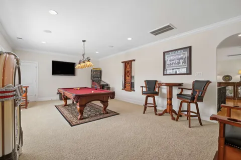 a bathroom with a tub shower and vanity