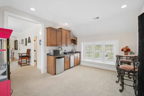 a view of a house with a yard and garage