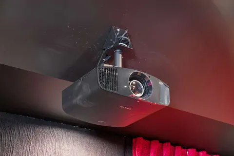 a view of a house with a big yard plants and large trees