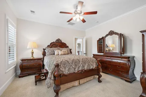 an aerial view of residential houses with outdoor space and trees