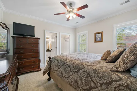 an aerial view of a house with a garden and lake view