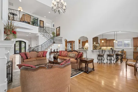 a kitchen with granite countertop a sink a stove and cabinets