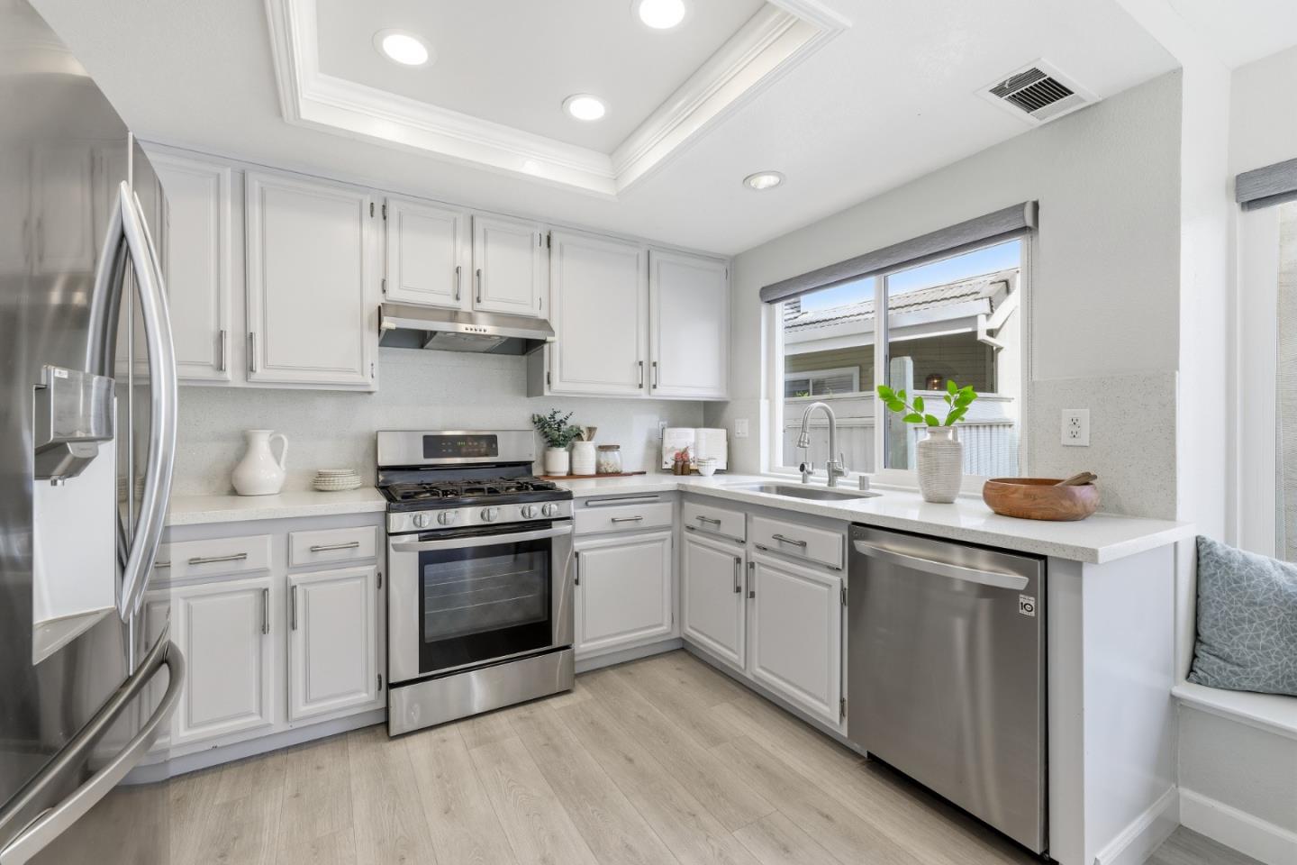 2896 Barrington Terrace Fremont, CA 94536 - Photo 19 of 64 a kitchen with a stove sink and refrigerator