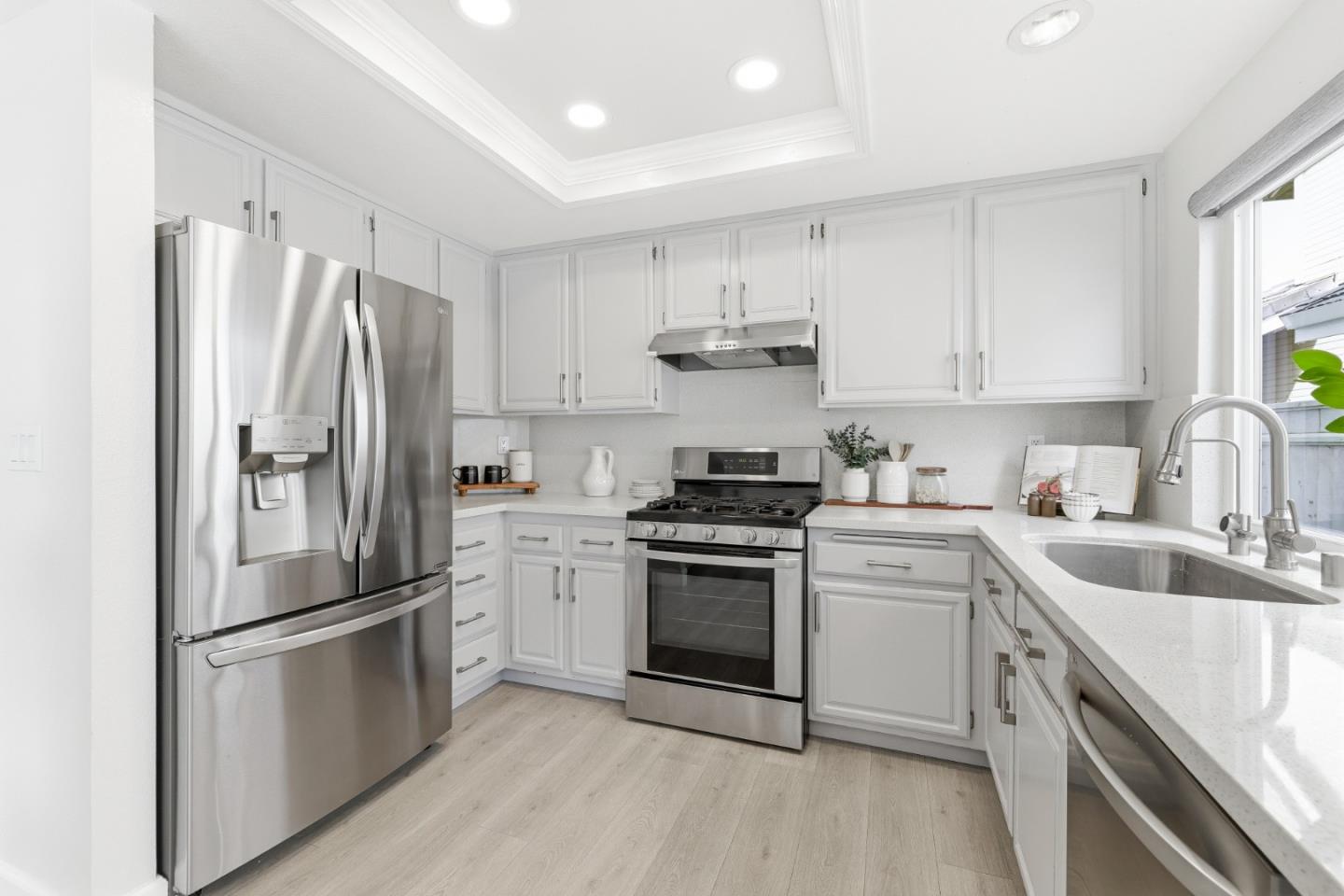 2896 Barrington Terrace Fremont, CA 94536 - Photo 20 of 64 a kitchen with stainless steel appliances a refrigerator sink and cabinets