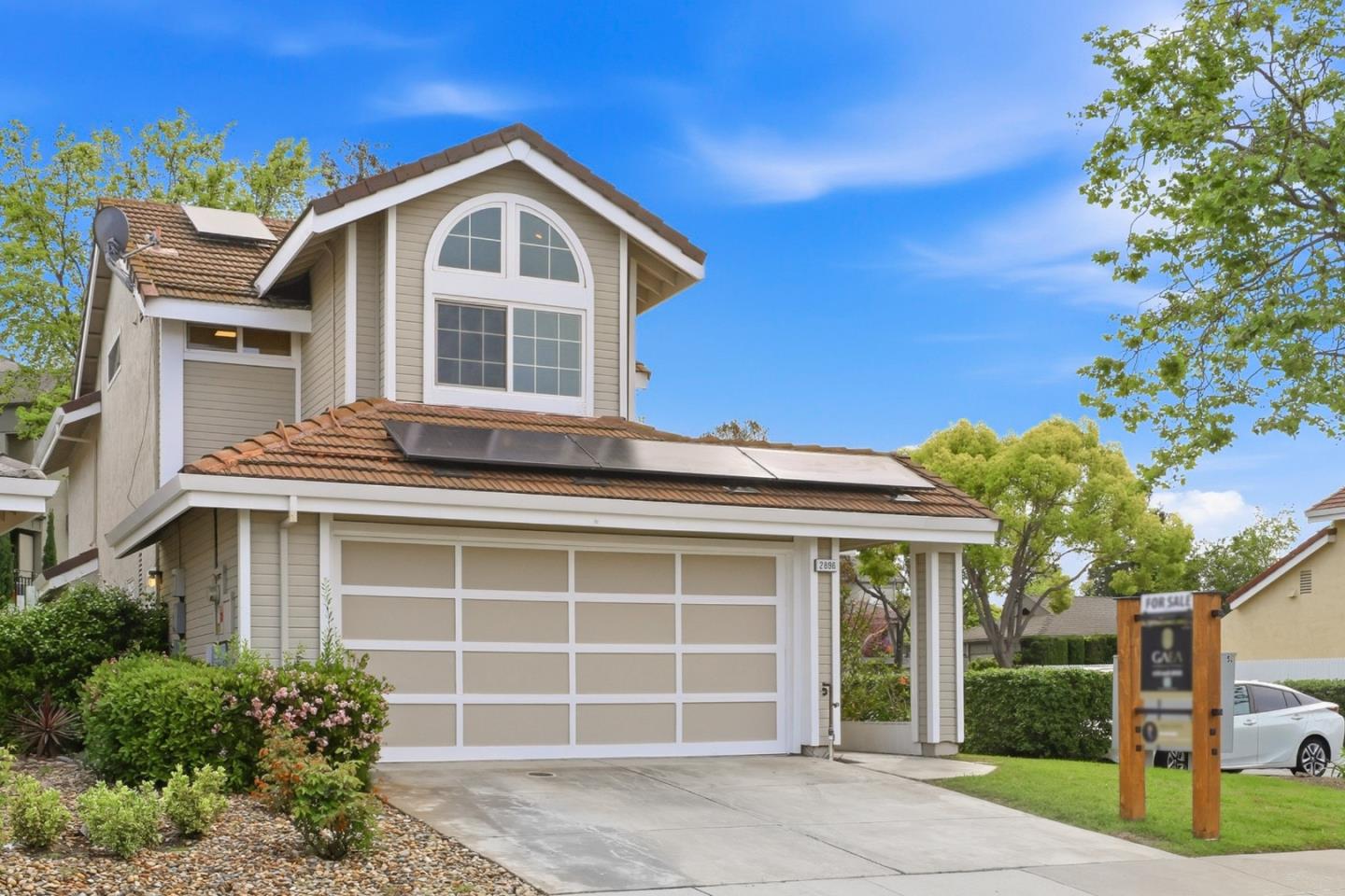 2896 Barrington Terrace Fremont, CA 94536 - Photo 2 of 64 a front view of a house with a yard and garage