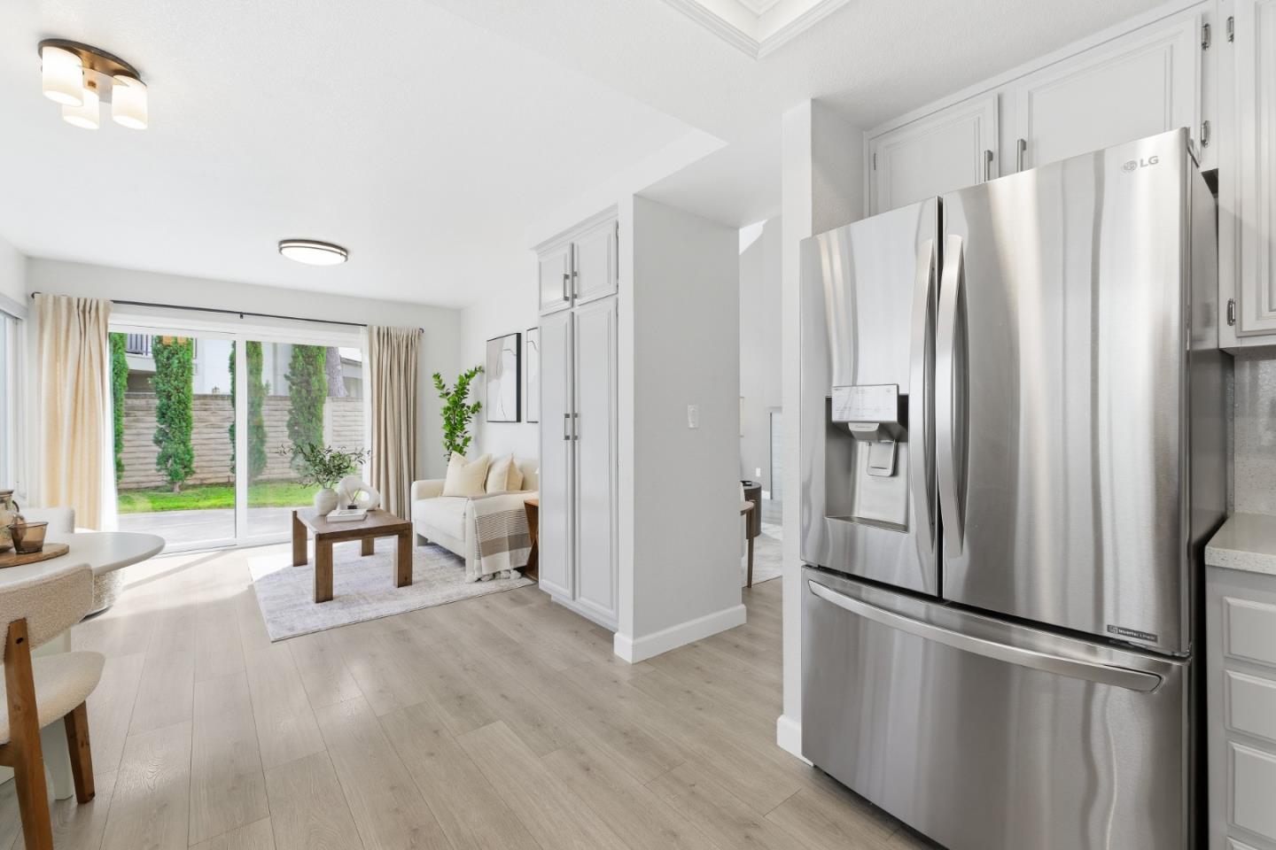 2896 Barrington Terrace Fremont, CA 94536 - Photo 21 of 64 a kitchen with stainless steel appliances a refrigerator and wooden floor