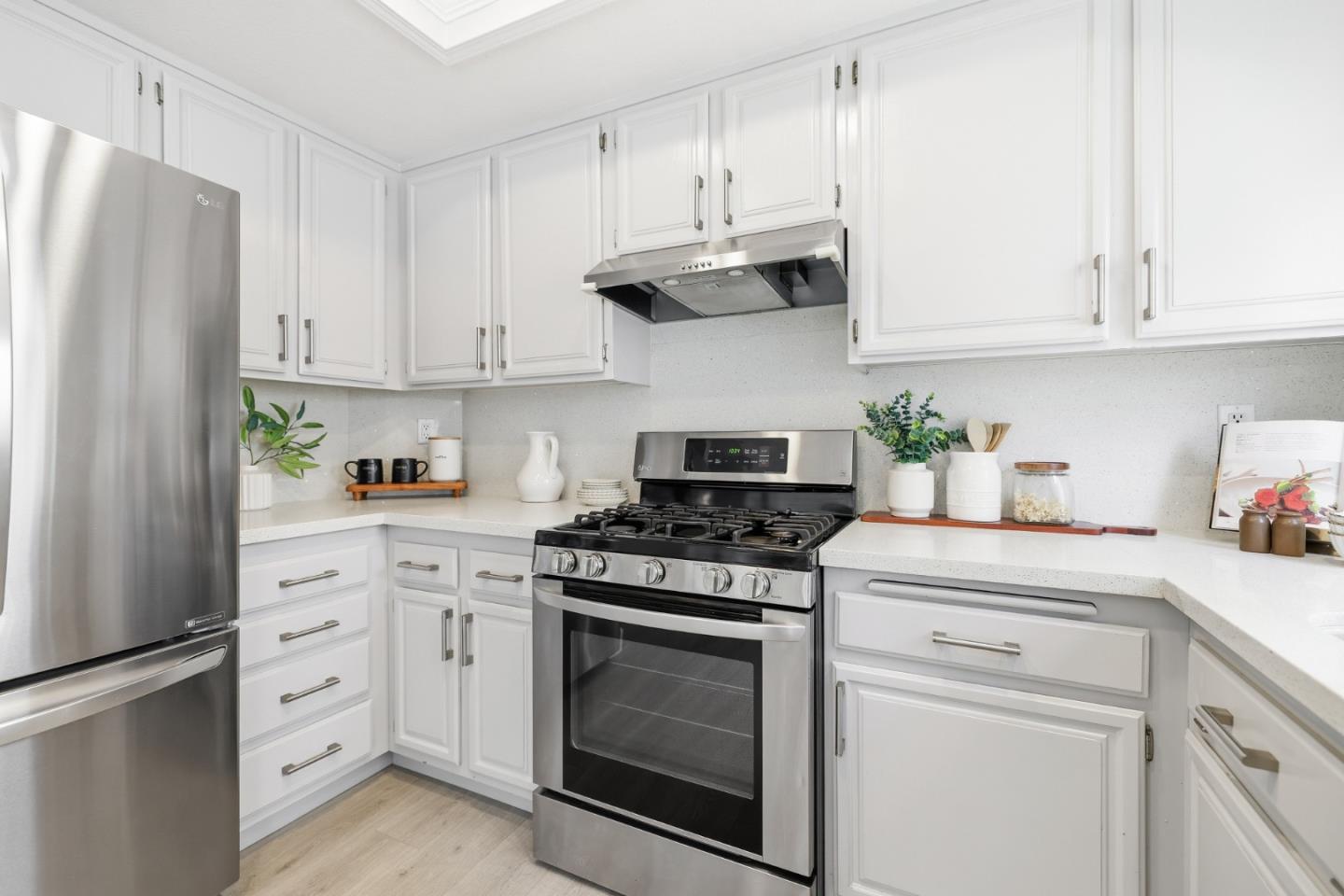 2896 Barrington Terrace Fremont, CA 94536 - Photo 23 of 64 a kitchen with cabinets stainless steel appliances and a counter space