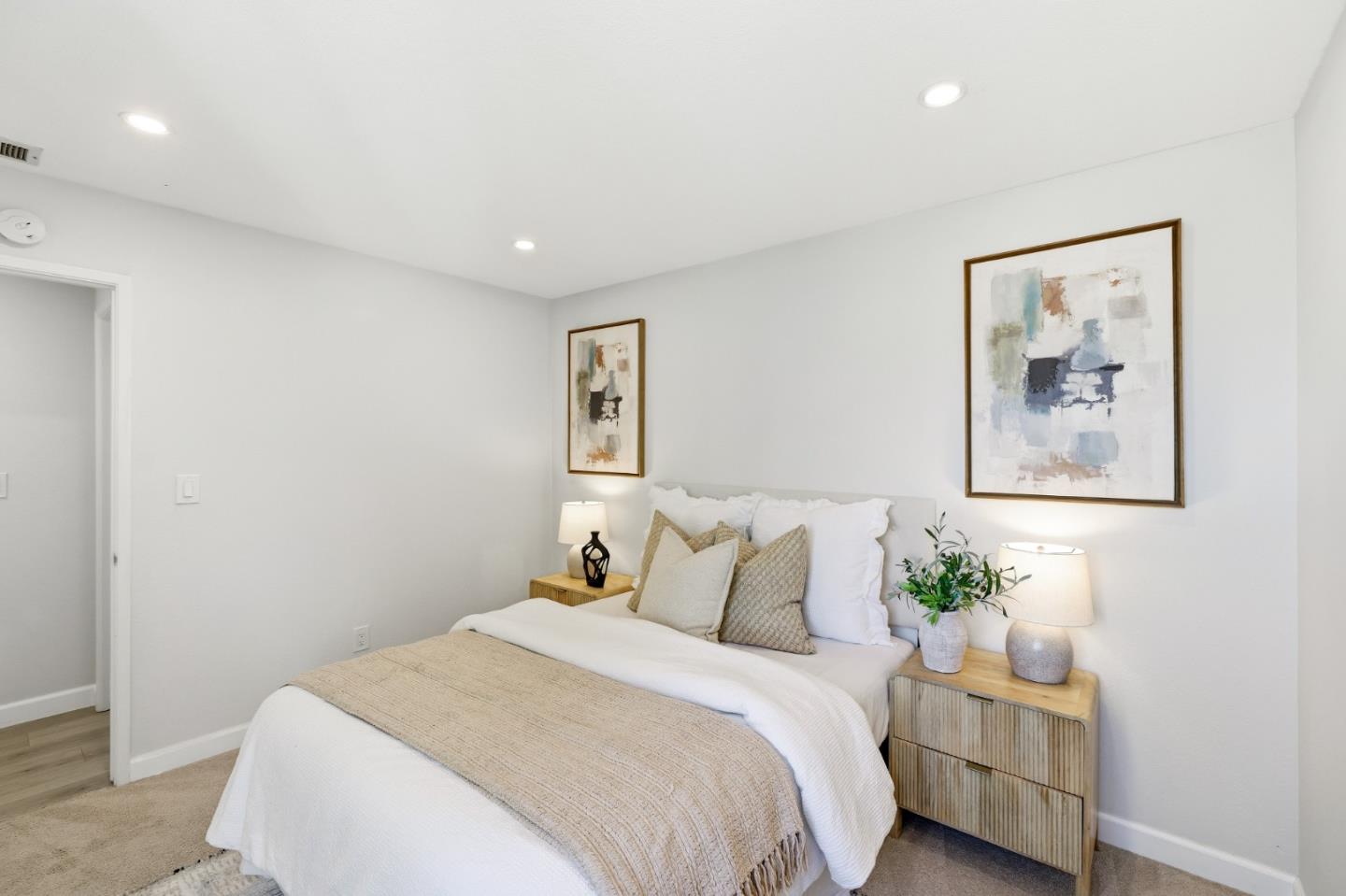 2896 Barrington Terrace Fremont, CA 94536 - Photo 32 of 64 a bedroom with a bed and a painting on the wall