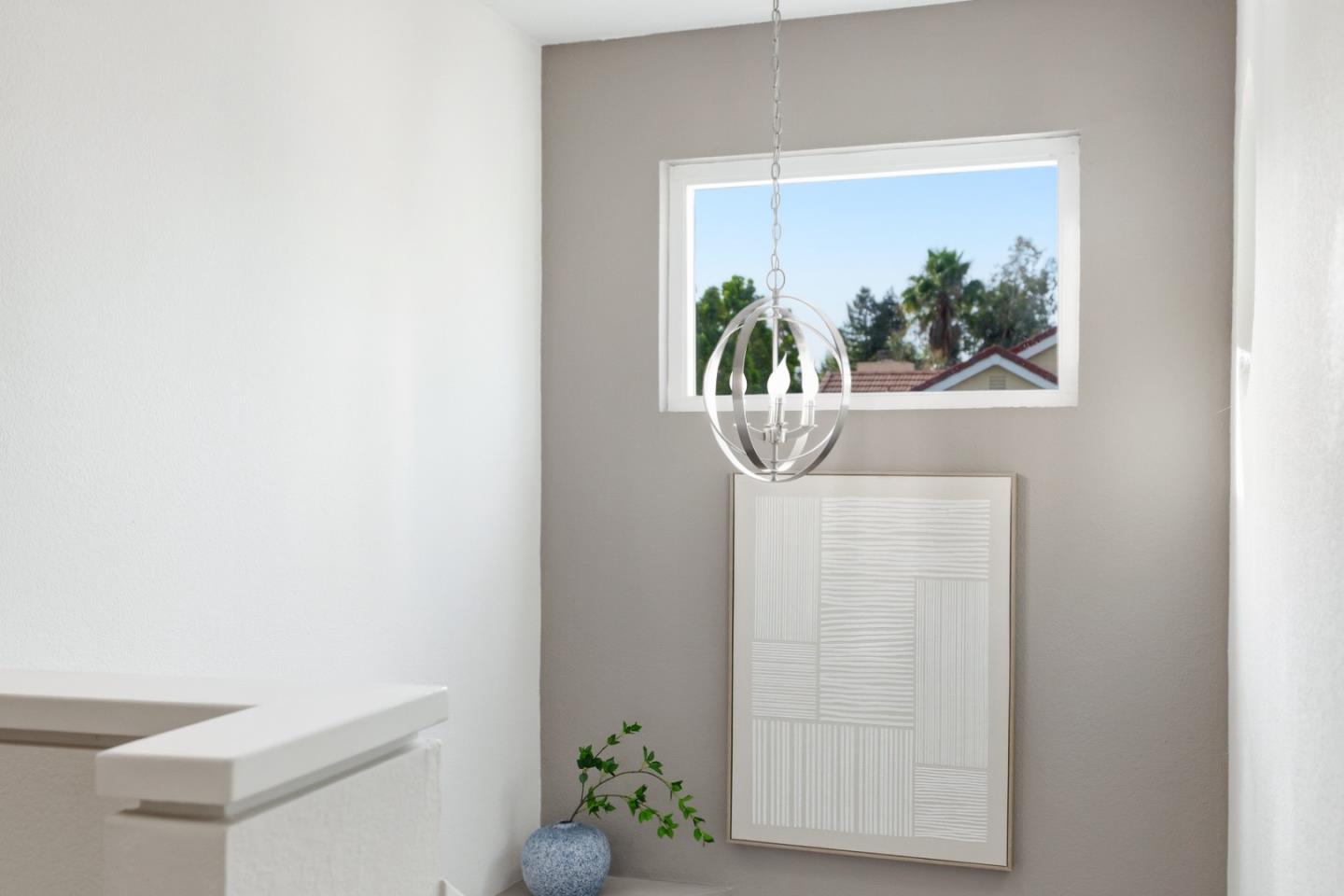 2896 Barrington Terrace Fremont, CA 94536 - Photo 46 of 64 a view of a hallway with wooden floor and a potted plant