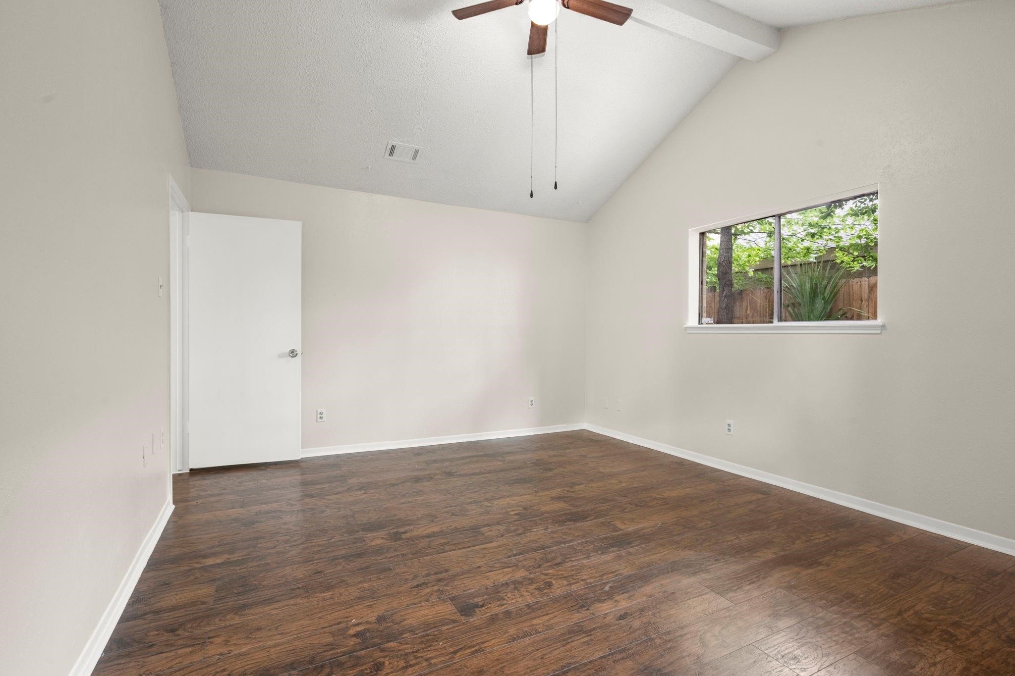 11718 Ridge Run Drive Houston, TX 77064 - Photo 14 of 17 an empty room with wooden floor and windows