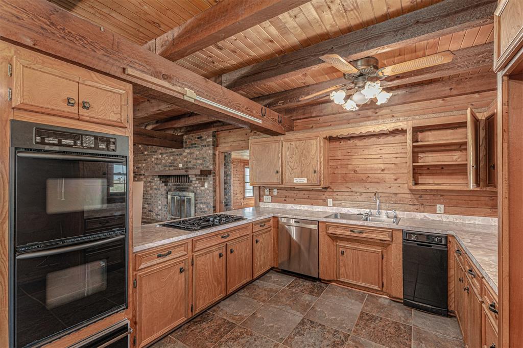 198 VZ County Road Ben Wheeler, TX 75754 - Photo 11 of 40 a kitchen with a sink stove and microwave
