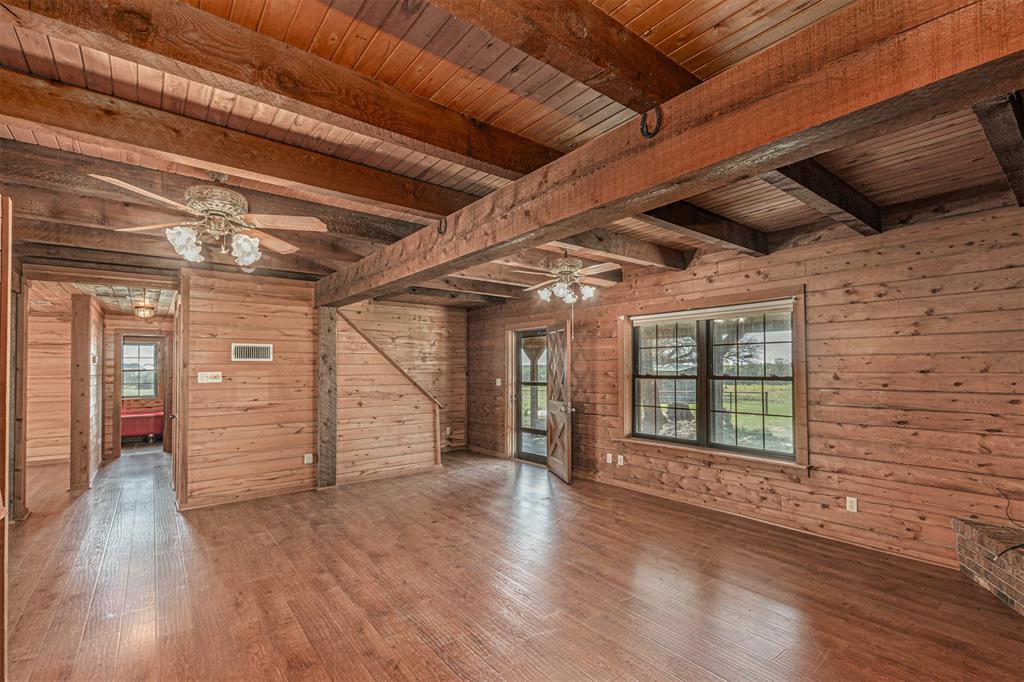 198 VZ County Road Ben Wheeler, TX 75754 - Photo 13 of 40 a view of an empty room with wooden floor and a window