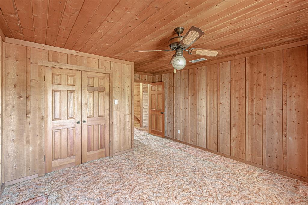 198 VZ County Road Ben Wheeler, TX 75754 - Photo 26 of 40 a view of a room with a chandelier fan and closet