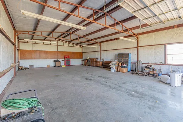 aerial view of a house with a lake view