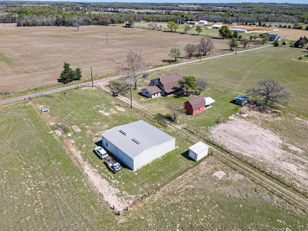an aerial view of a house with a lake view