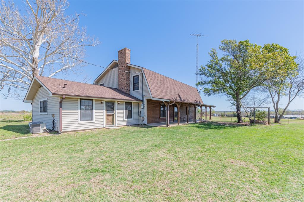198 VZ County Road Ben Wheeler, TX 75754 - Photo 5 of 40 a big house with a big yard and large trees