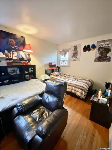 a bed room with a bed and a television