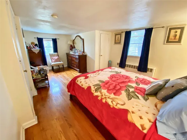 a living room with furniture and a mirror