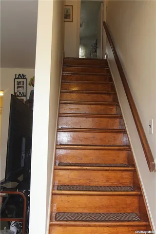 a bedroom with two beds and a dresser