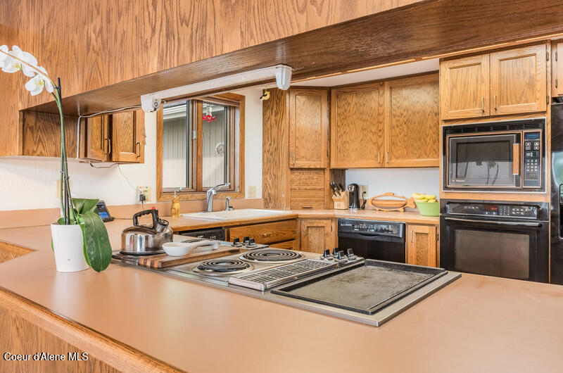 3574 East Tobler Road, Unit C12 Hayden, ID 83835 - Photo 18 of 45 Looking out from kitchen to lake