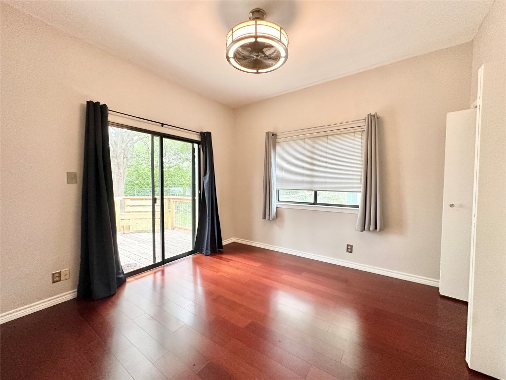 5504 Montview Street, Unit A OR B Austin, TX 78756 - Photo 19 of 27 an empty room with wooden floor and windows