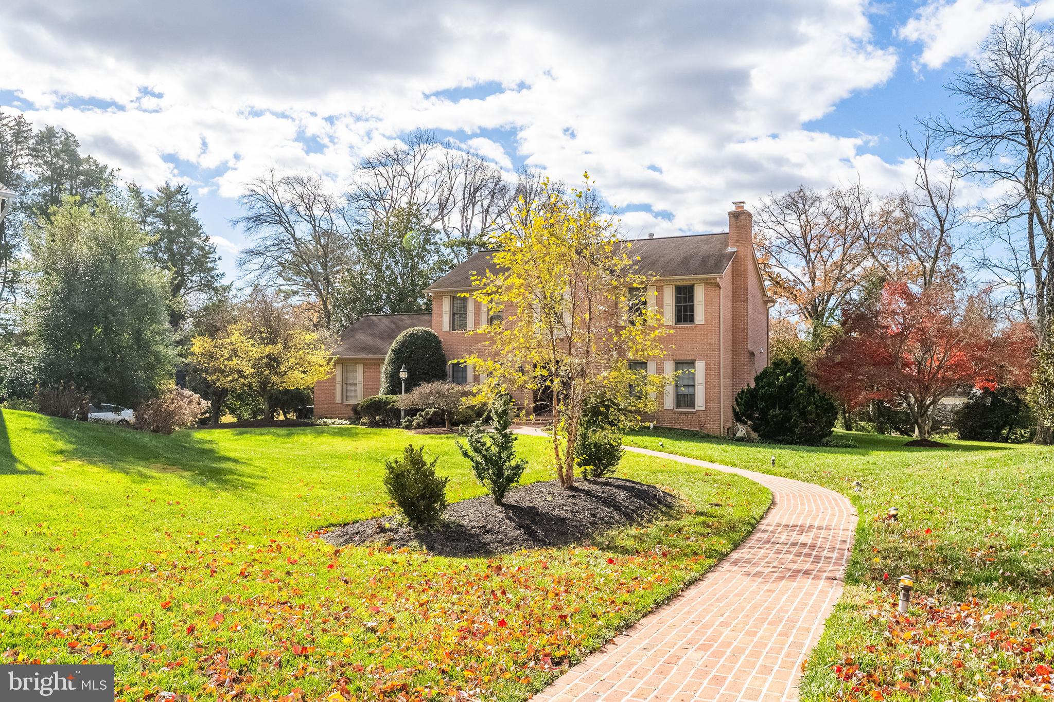 8454 Toll House Road Annandale, VA 22003 - Photo 16 of 65 a view of a house with a yard and table chairs