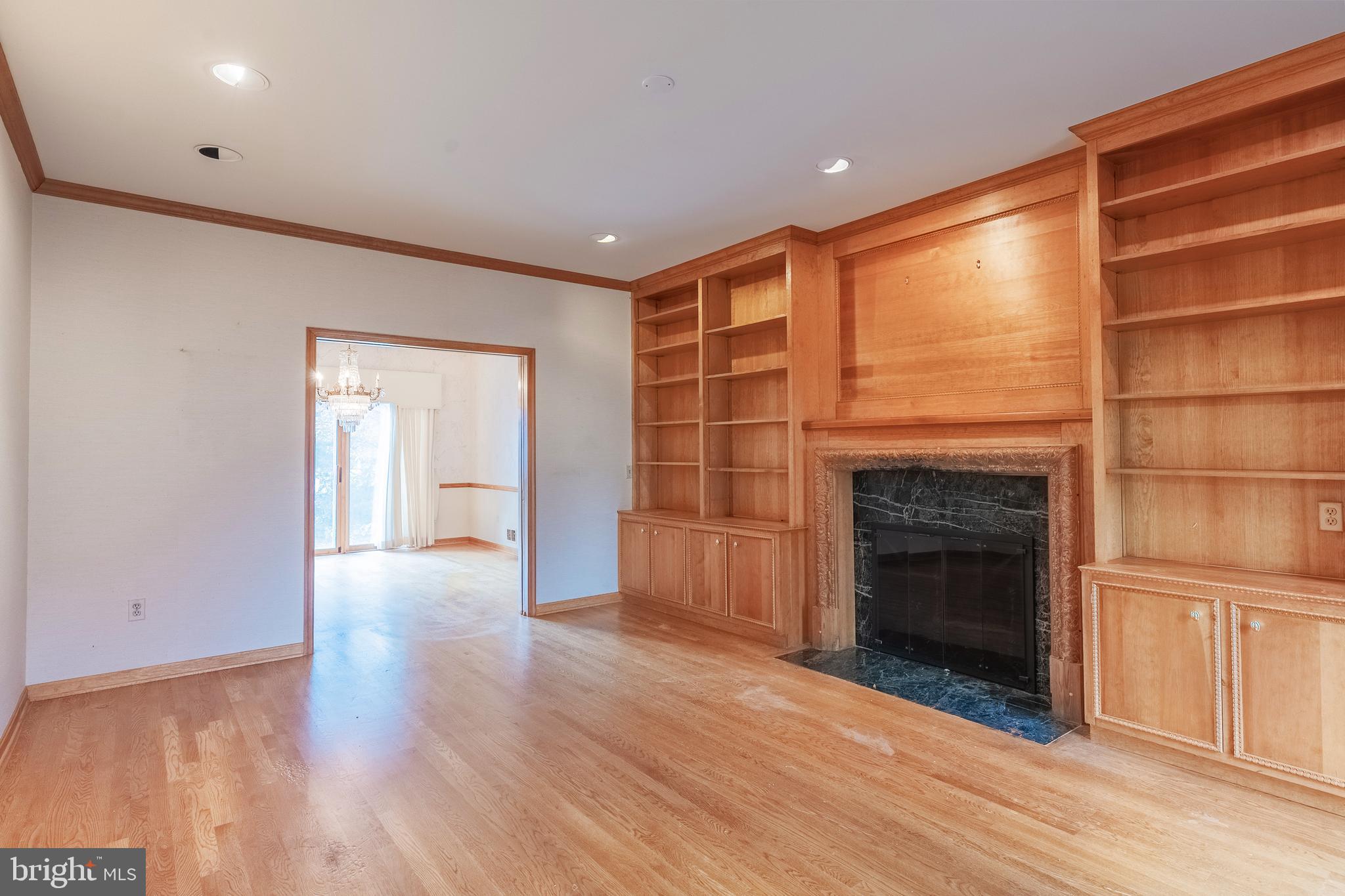 8454 Toll House Road Annandale, VA 22003 - Photo 24 of 65 a view of an empty room with a fireplace and a window