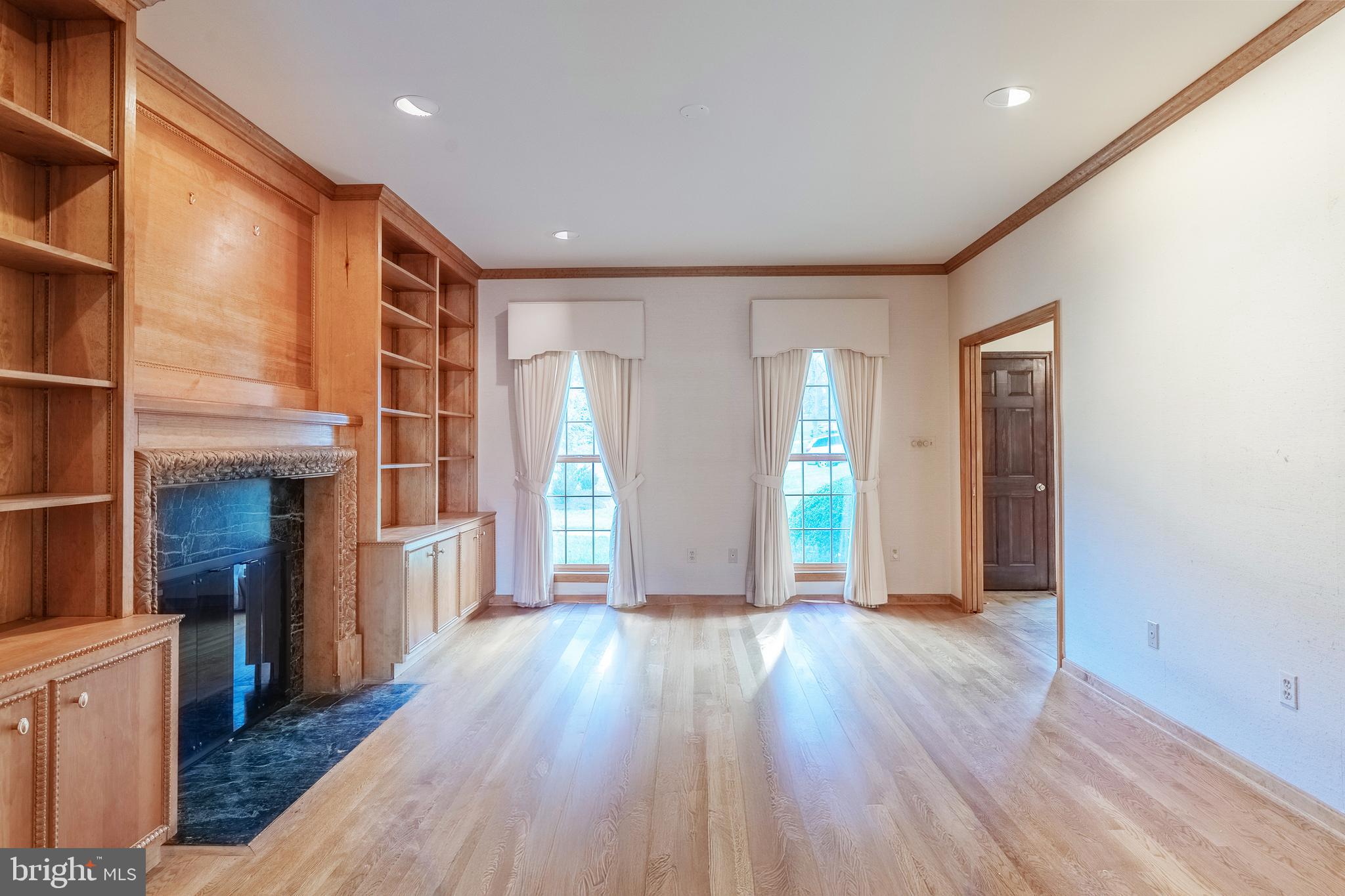 8454 Toll House Road Annandale, VA 22003 - Photo 25 of 65 a view of an empty room with wooden floor and a window