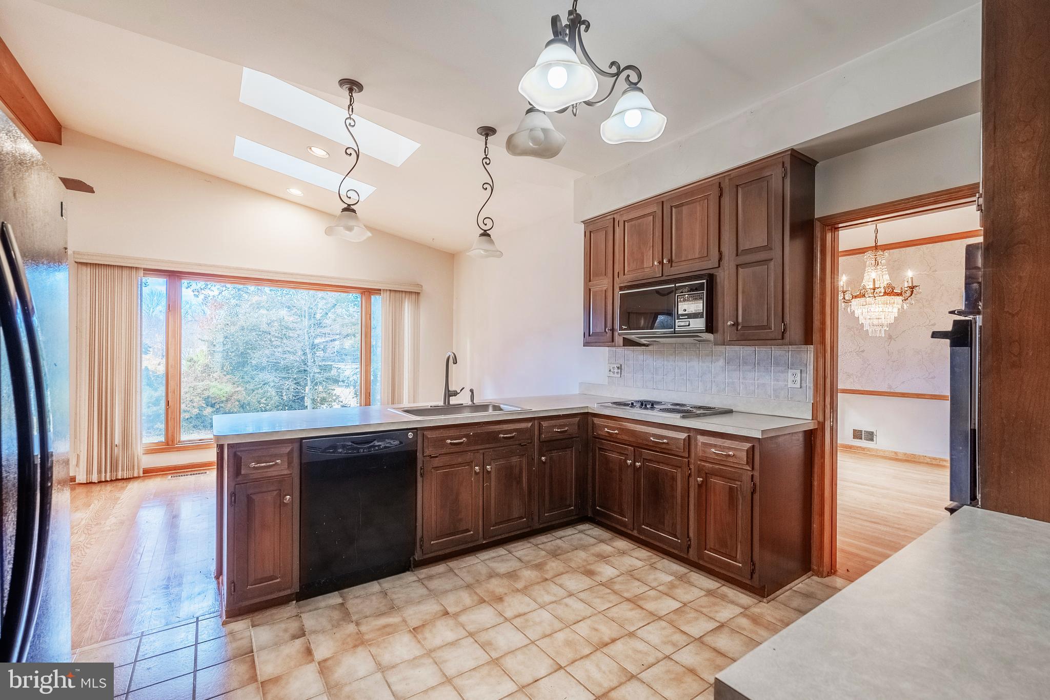 8454 Toll House Road Annandale, VA 22003 - Photo 29 of 65 a kitchen with stainless steel appliances granite countertop cabinets and a sink