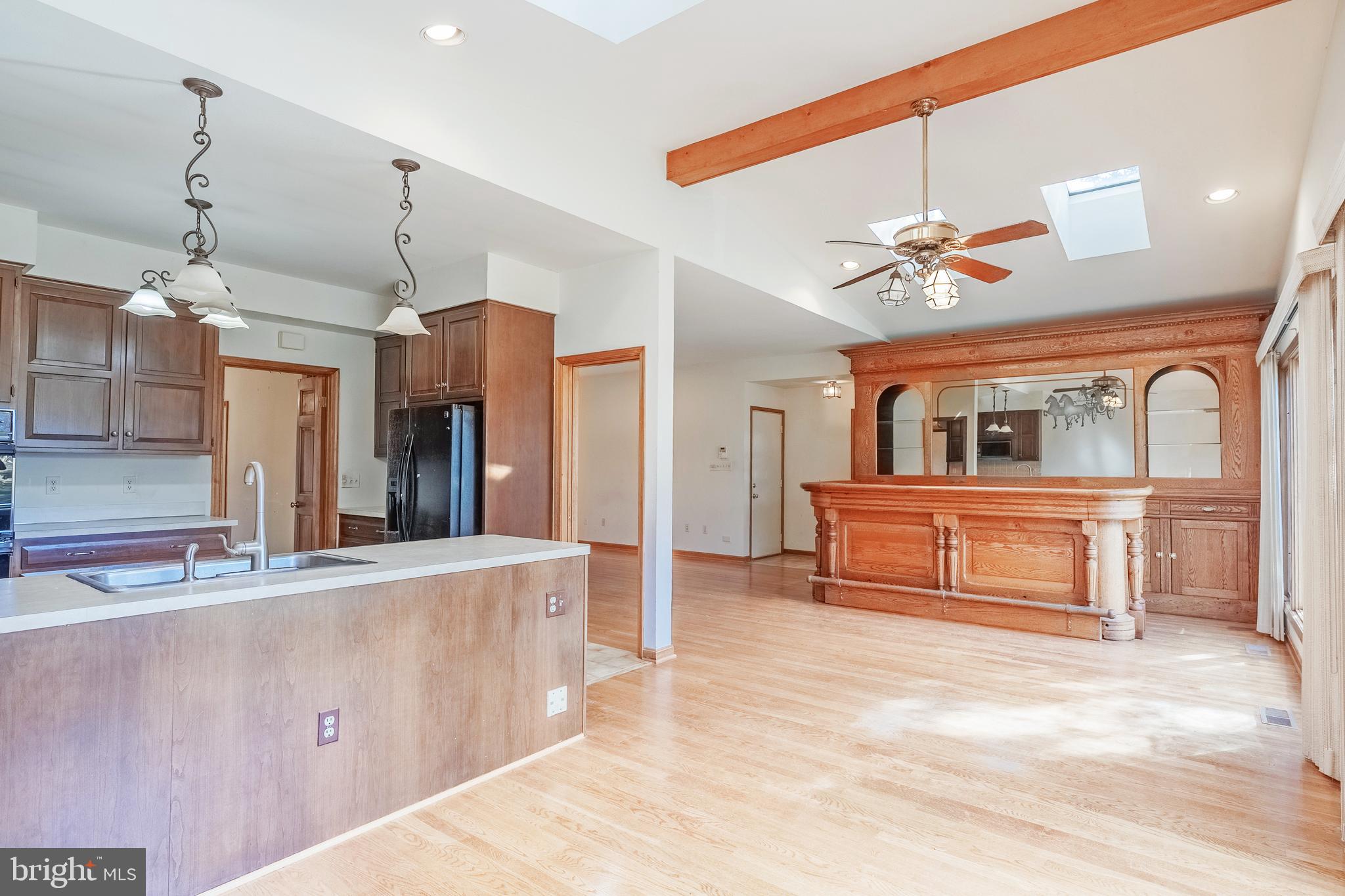 8454 Toll House Road Annandale, VA 22003 - Photo 31 of 65 a living room with stainless steel appliances kitchen island granite countertop furniture and a kitchen view