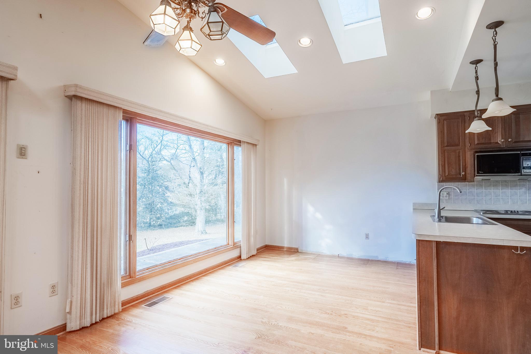 8454 Toll House Road Annandale, VA 22003 - Photo 32 of 65 a view of an empty room with a fireplace and a window