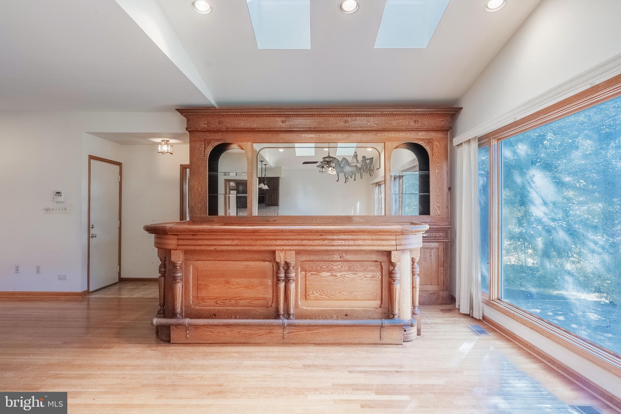 8454 Toll House Road Annandale, VA 22003 - Photo 33 of 65 a view of a hallway with entryway wooden floor and front door