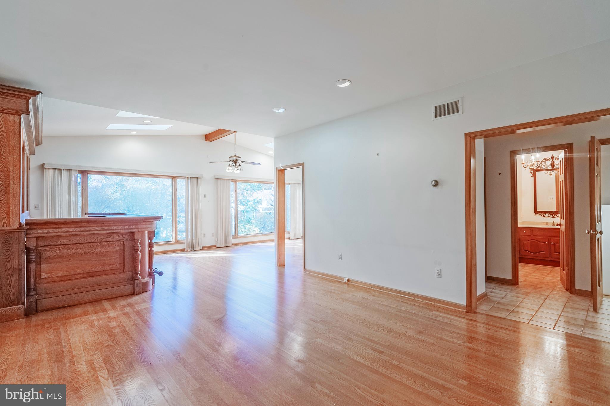 8454 Toll House Road Annandale, VA 22003 - Photo 36 of 65 a view of an empty room with wooden floor and a window