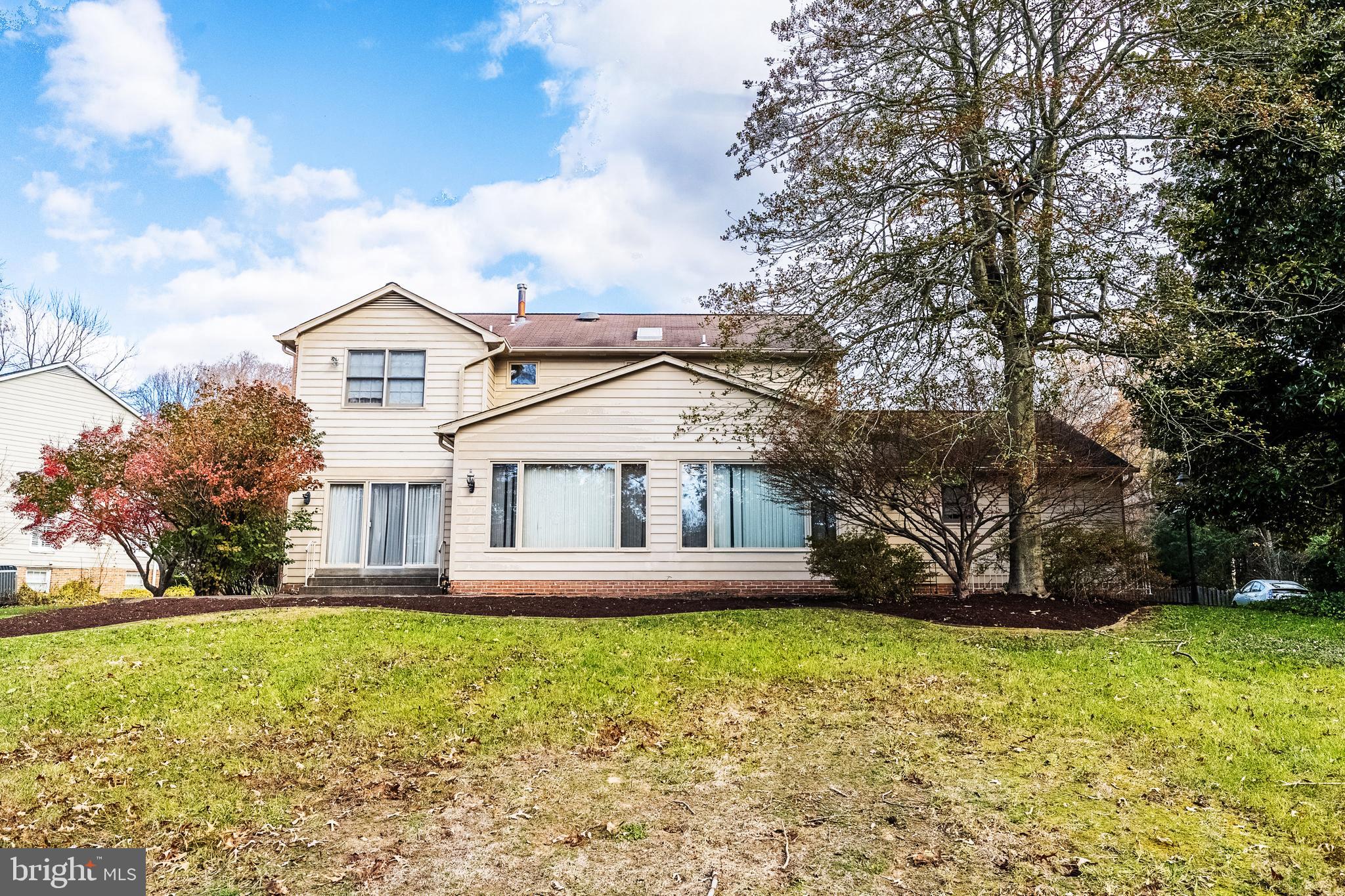 8454 Toll House Road Annandale, VA 22003 - Photo 4 of 65 a front view of a house with garden