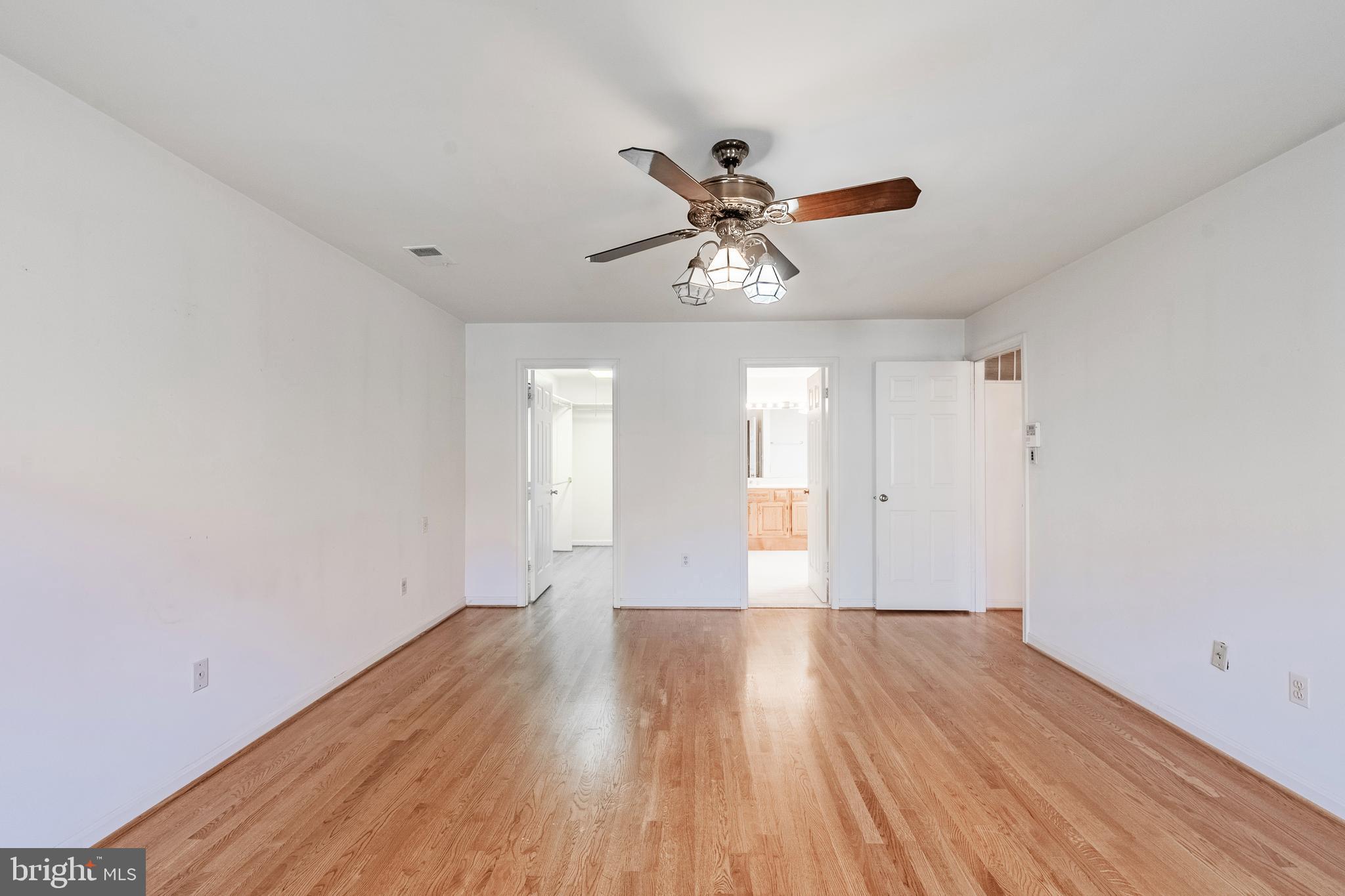 8454 Toll House Road Annandale, VA 22003 - Photo 41 of 65 a view of an empty room with wooden floor and a window