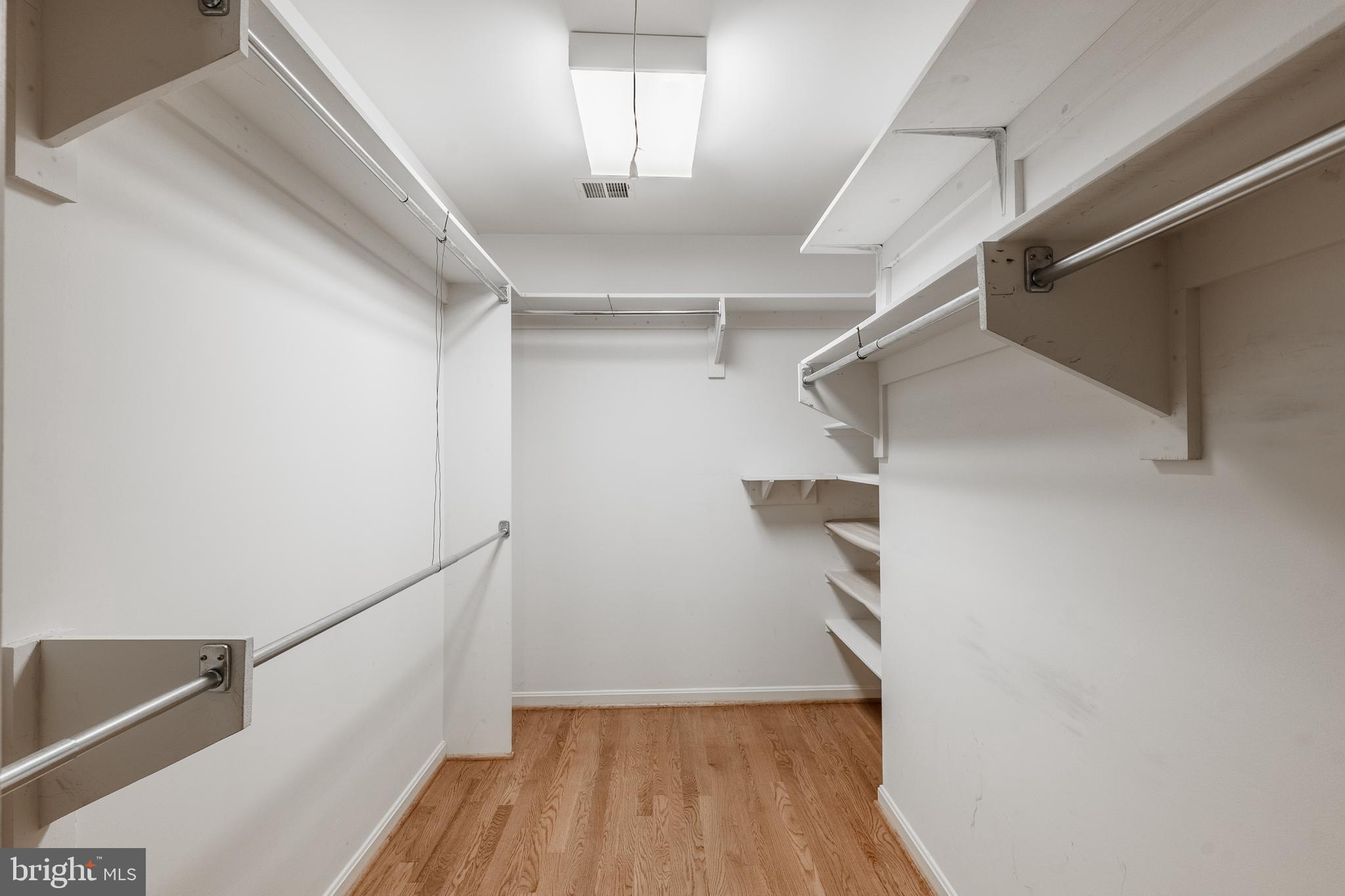 8454 Toll House Road Annandale, VA 22003 - Photo 42 of 65 a view of hallway with stairs and wooden floor