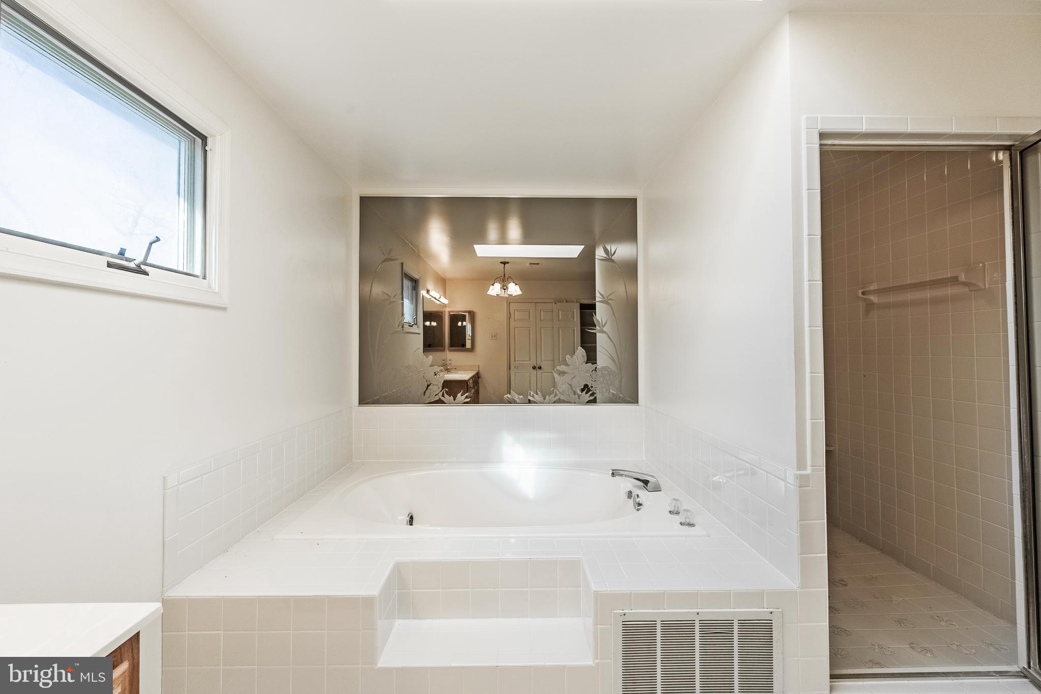 8454 Toll House Road Annandale, VA 22003 - Photo 46 of 65 a bathroom with a bathtub and a sink