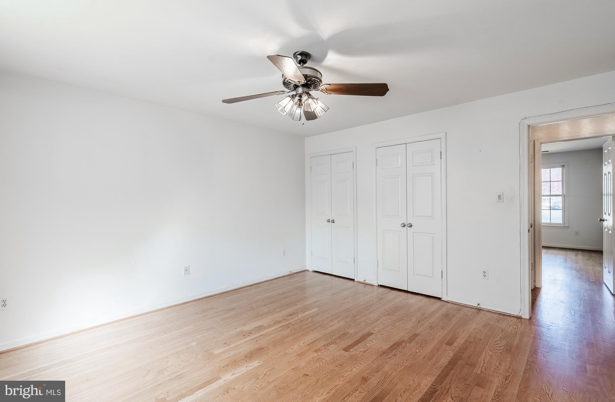 8454 Toll House Road Annandale, VA 22003 - Photo 50 of 65 wooden floor in an empty room with a window