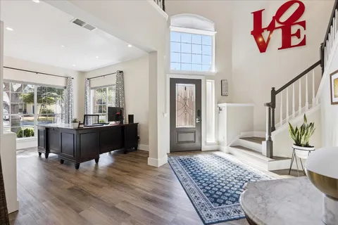 a living room with furniture rug and window