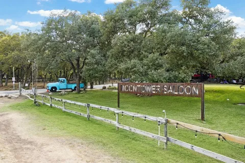 a view of a park with large trees
