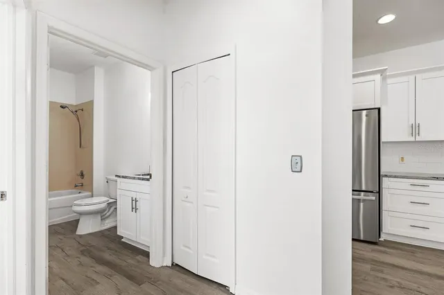 a bathroom with a toilet a sink and a mirror