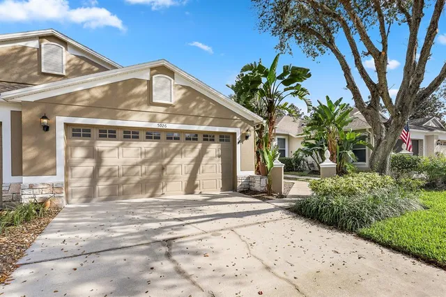 a view of a white house with a outdoor space