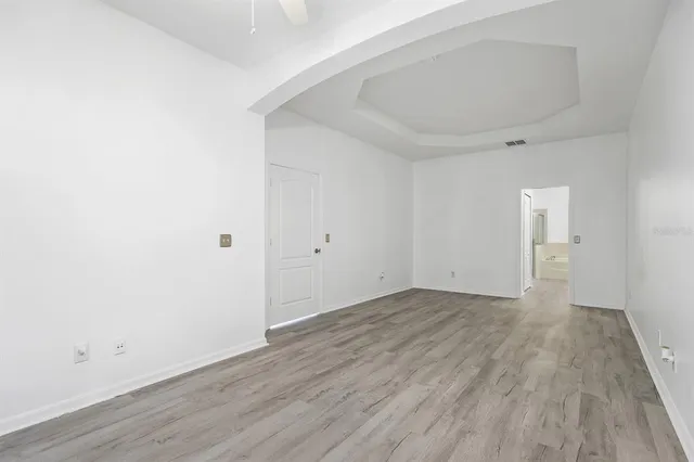 an empty room with wooden floor