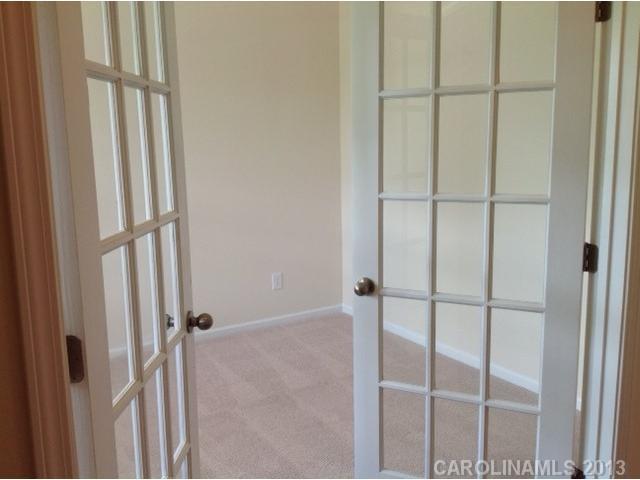 78047 Rillstone Drive, Unit 236 Lancaster, SC 29720 - Photo 2 of 16 a bathroom with a glass shower door