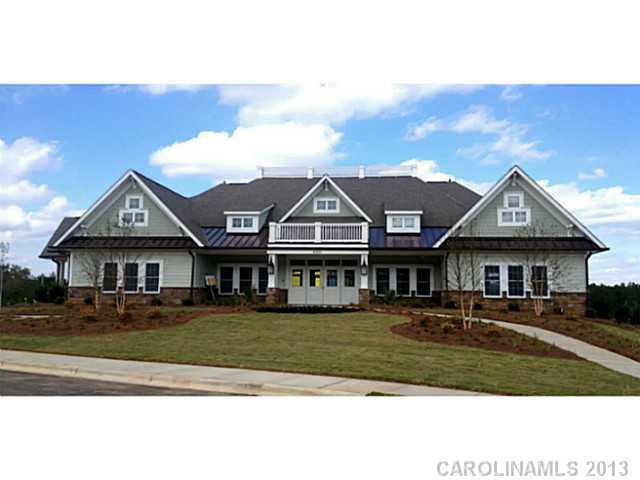 78047 Rillstone Drive, Unit 236 Lancaster, SC 29720 - Photo 12 of 16 a front view of a house with a yard